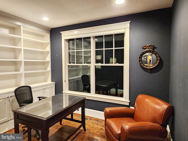 office area featuring hardwood / wood-style flooring and built in features