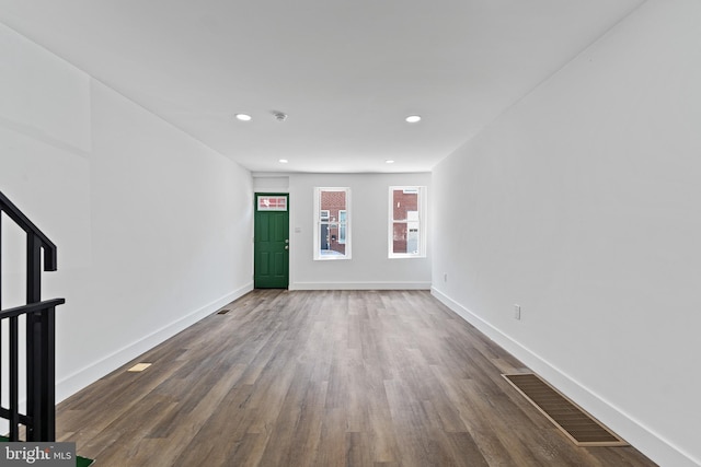 unfurnished room featuring dark hardwood / wood-style flooring