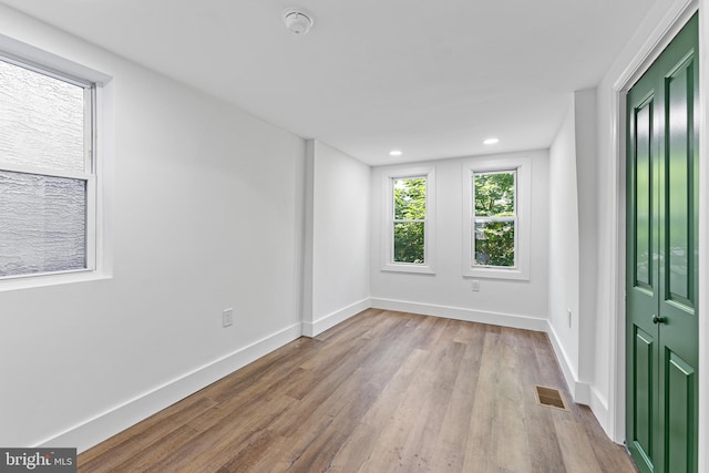 spare room featuring light hardwood / wood-style floors