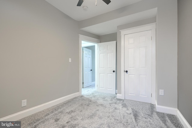 bedroom featuring light carpet, a closet, and ceiling fan