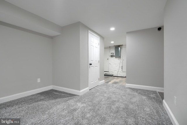 interior space with electric panel and carpet