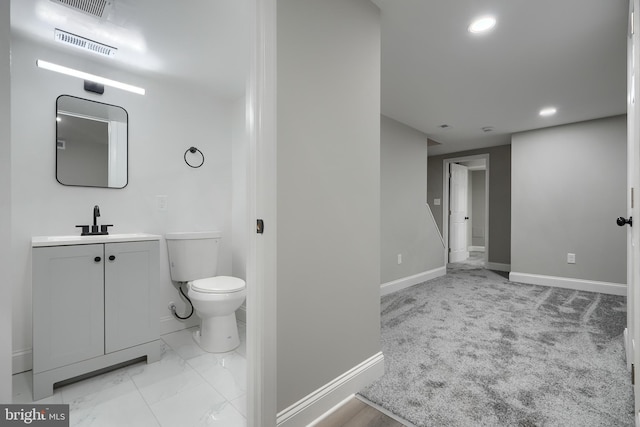 bathroom with vanity and toilet