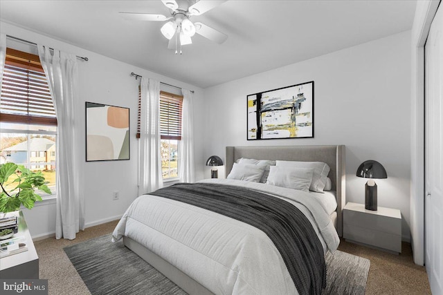 bedroom featuring carpet floors, a ceiling fan, and baseboards