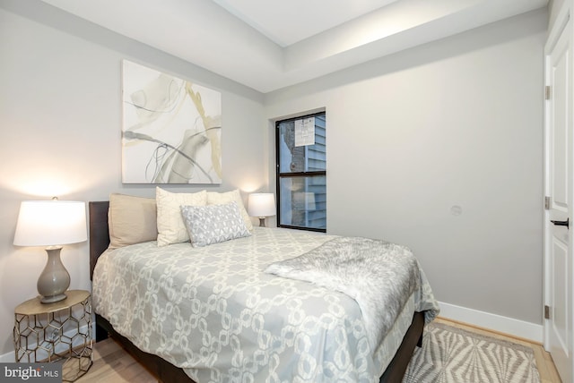 bedroom with wood-type flooring