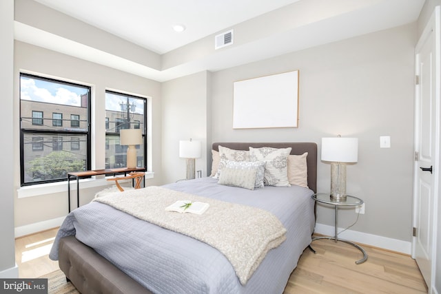 bedroom with light hardwood / wood-style floors