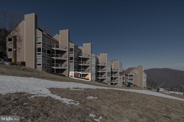 view of building exterior with a mountain view