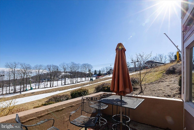 view of snow covered patio