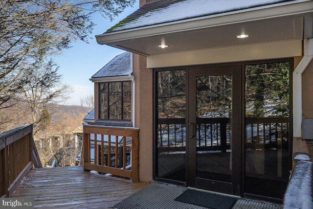 property entrance with french doors and a deck with mountain view