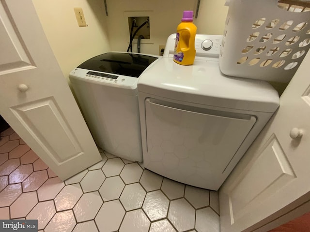 washroom with washer and clothes dryer