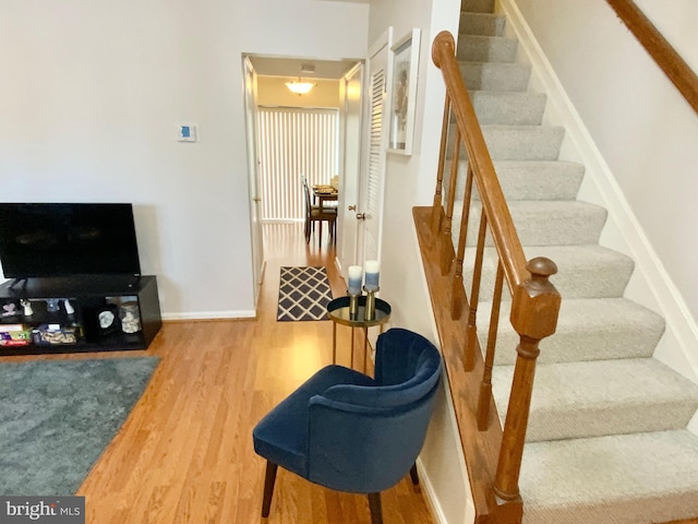 stairs with wood-type flooring