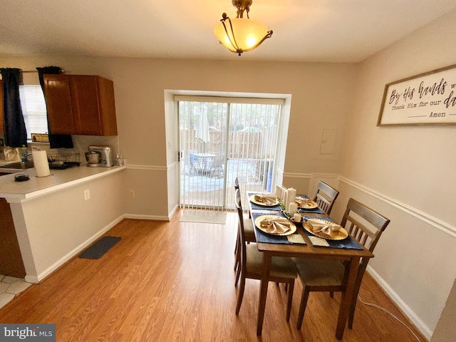 dining room featuring light hardwood / wood-style floors