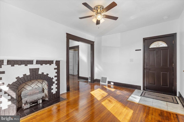 entrance foyer featuring dark hardwood / wood-style floors and ceiling fan