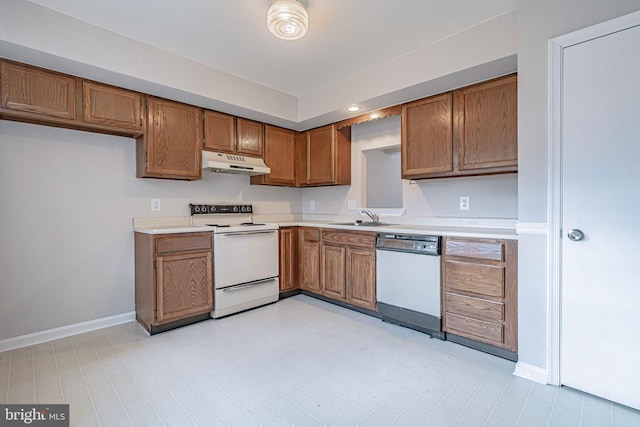 kitchen featuring sink and white appliances