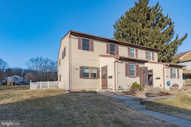 front facade with a front yard