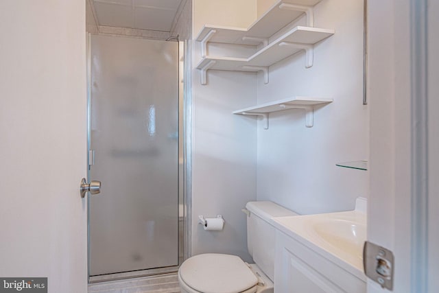 bathroom with walk in shower, wood-type flooring, vanity, and toilet