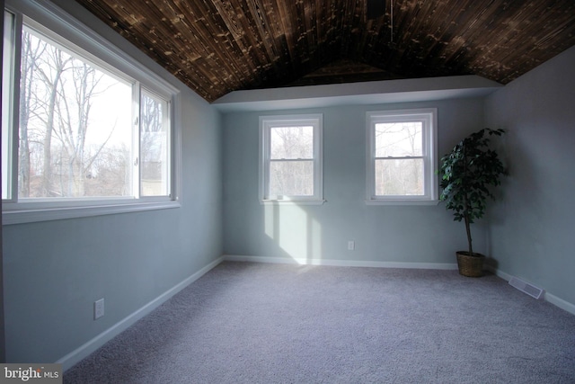 spare room with wood ceiling, lofted ceiling, and carpet floors