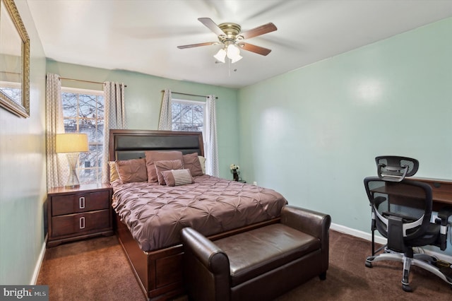 bedroom featuring dark colored carpet and ceiling fan