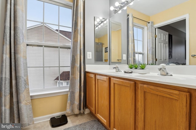 bathroom featuring tile patterned flooring and vanity