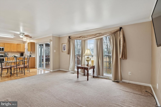 interior space featuring crown molding and light colored carpet