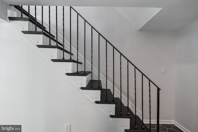 staircase with baseboards