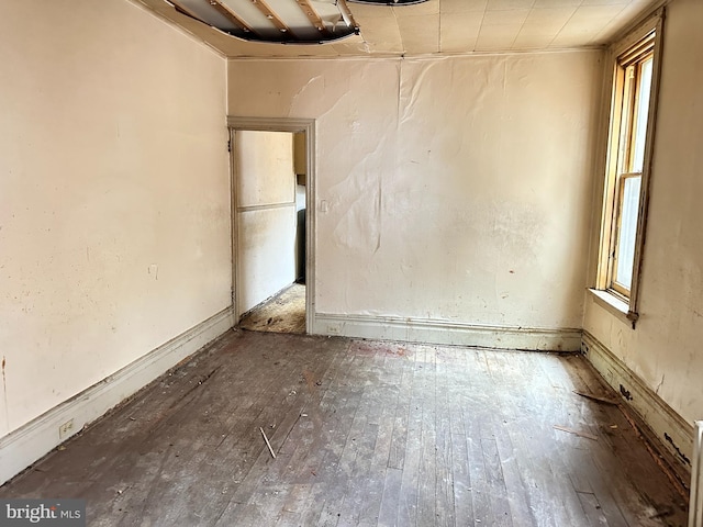 unfurnished room featuring wood-type flooring