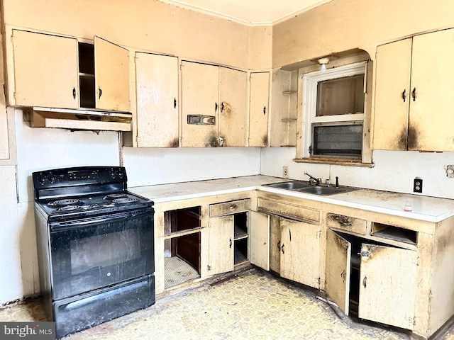 kitchen featuring sink and electric range