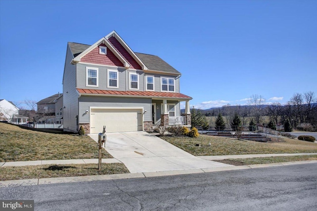 craftsman-style home featuring a garage, a front yard, and a porch