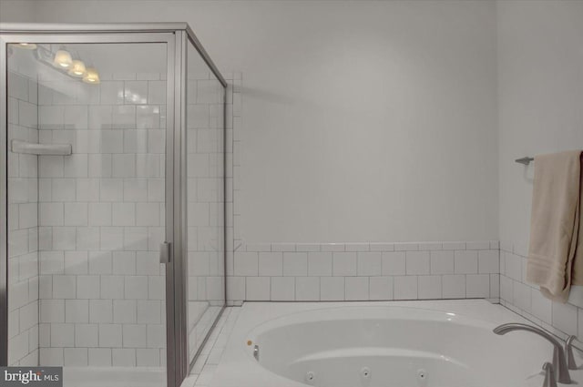 bathroom with tiled tub