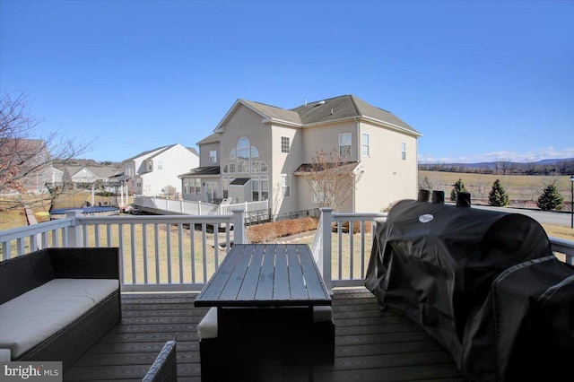 wooden deck featuring grilling area