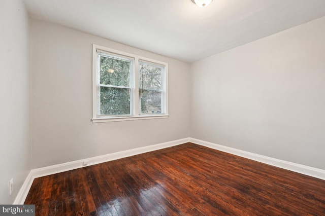 spare room with hardwood / wood-style flooring