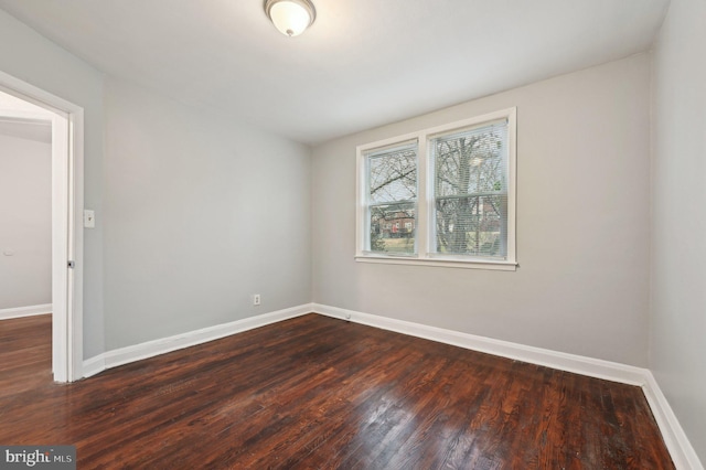 empty room featuring dark hardwood / wood-style floors