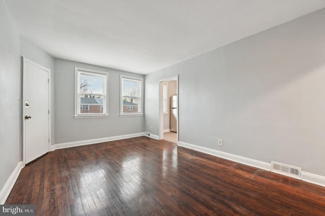 empty room featuring dark hardwood / wood-style floors