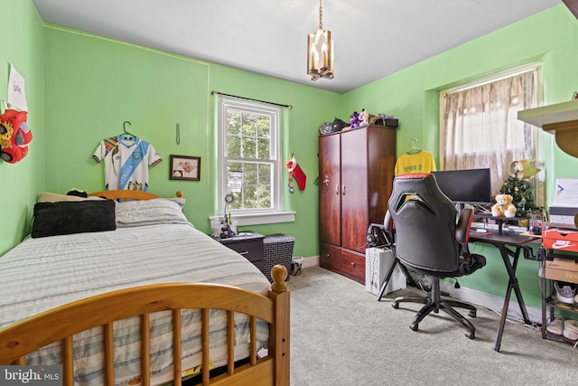 bedroom featuring light carpet