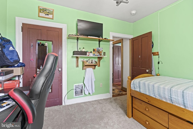 bedroom with light colored carpet