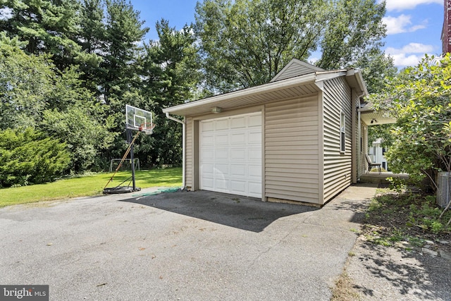 garage featuring a yard