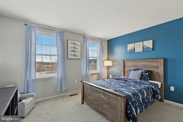 bedroom with light colored carpet