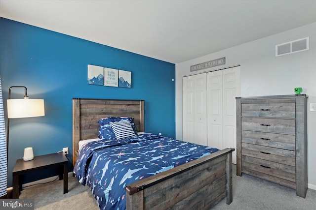 carpeted bedroom featuring a closet