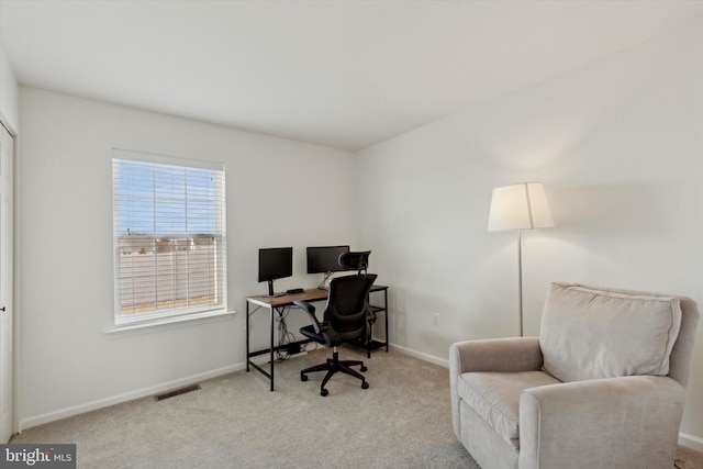 home office featuring light colored carpet