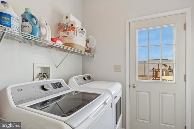 washroom with washer and dryer