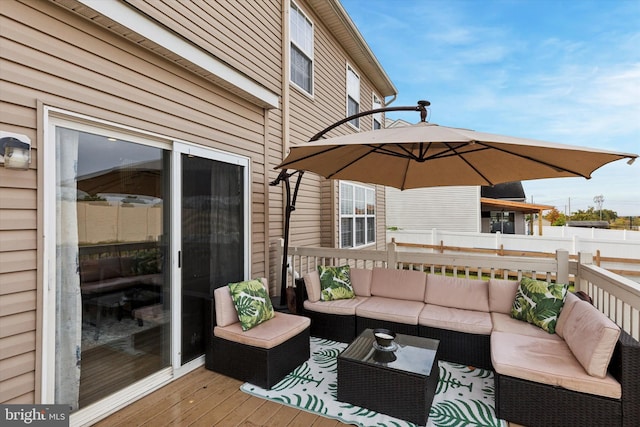 wooden terrace with outdoor lounge area