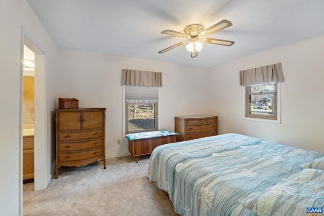 bedroom with light carpet and ceiling fan