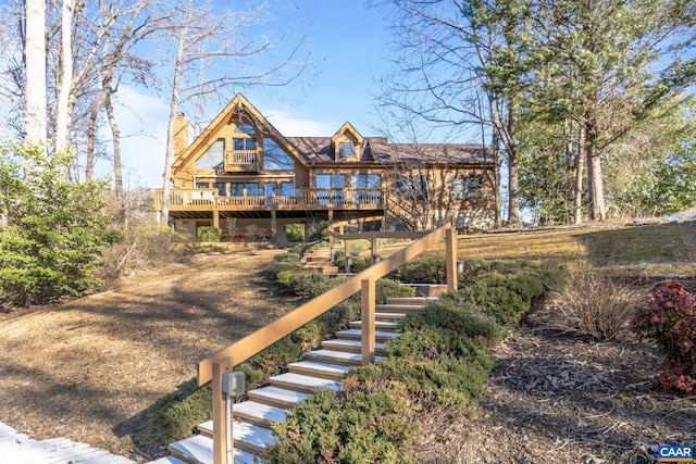 back of property with a wooden deck