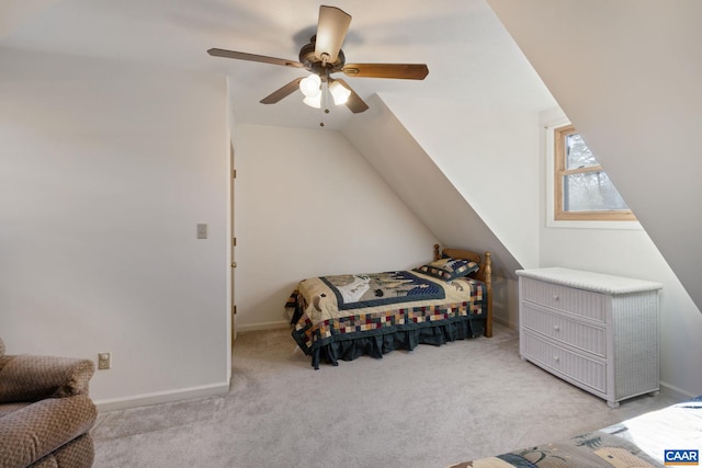 bedroom featuring light carpet, vaulted ceiling, and ceiling fan