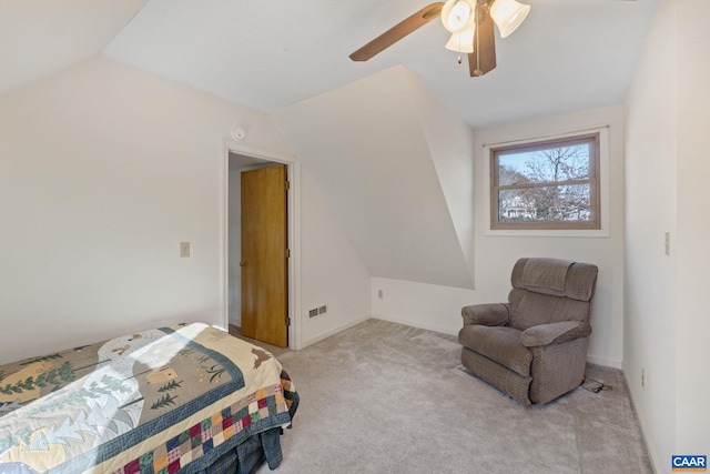 bedroom featuring ceiling fan, light colored carpet, and lofted ceiling