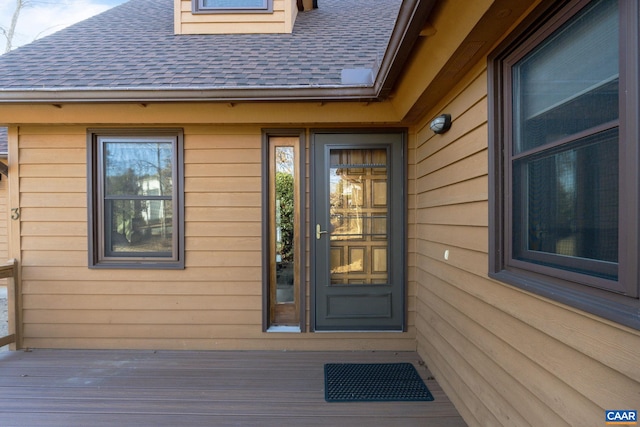 entrance to property featuring a deck