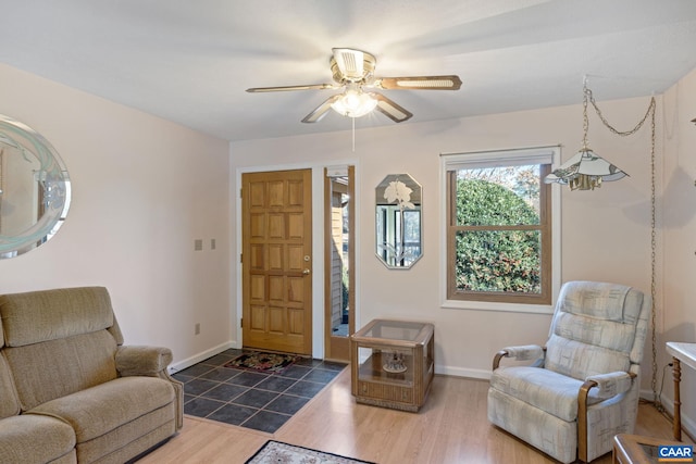 interior space with ceiling fan and dark hardwood / wood-style floors