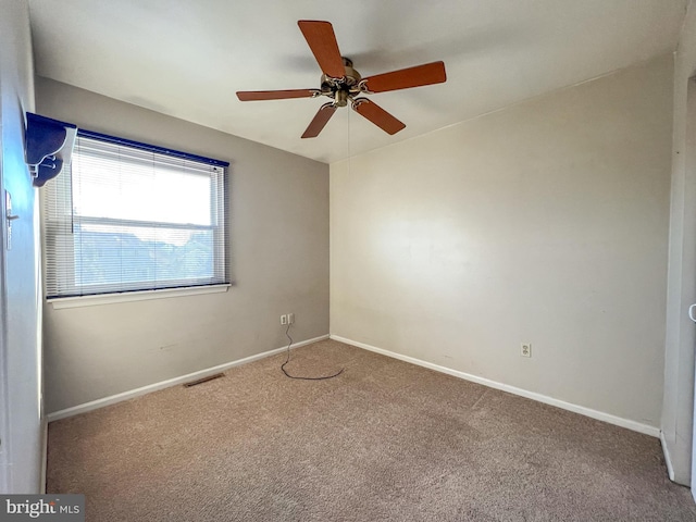 carpeted empty room with ceiling fan