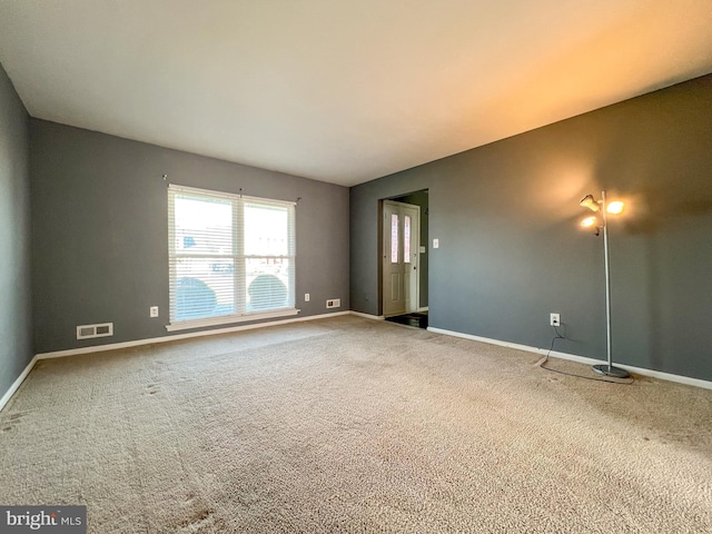 empty room featuring carpet floors