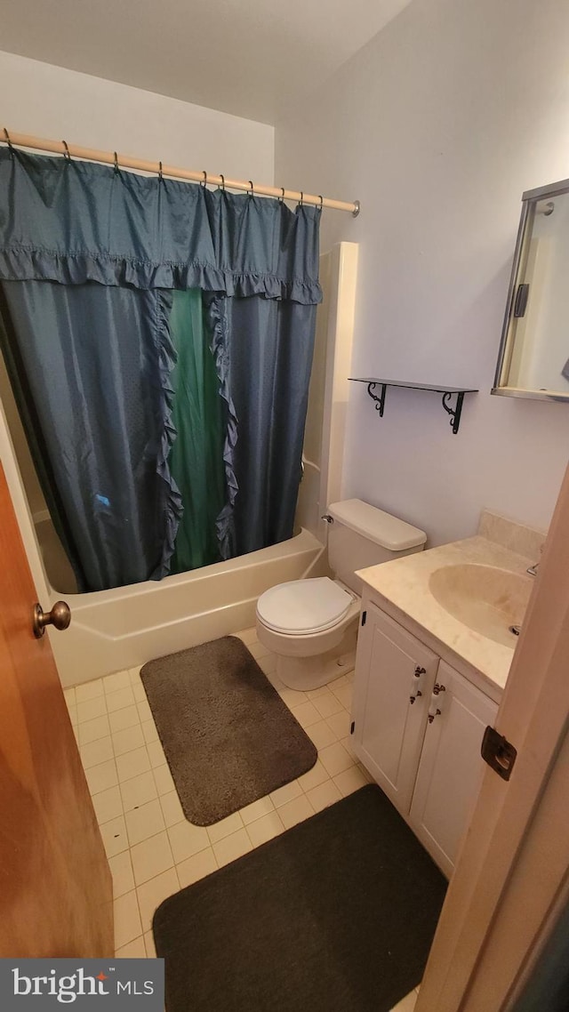 full bathroom featuring vanity, tile patterned floors, shower / bath combination with curtain, and toilet