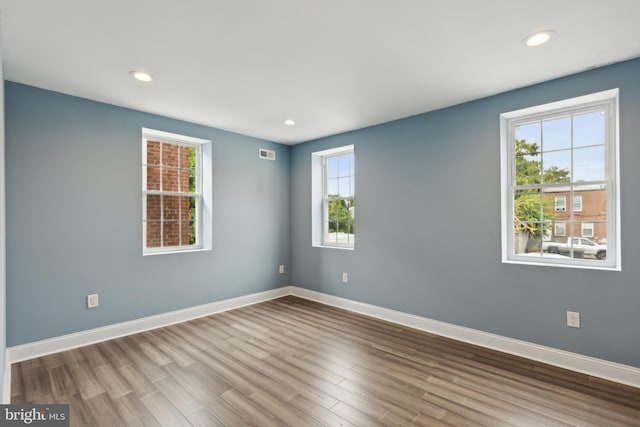 empty room featuring hardwood / wood-style floors